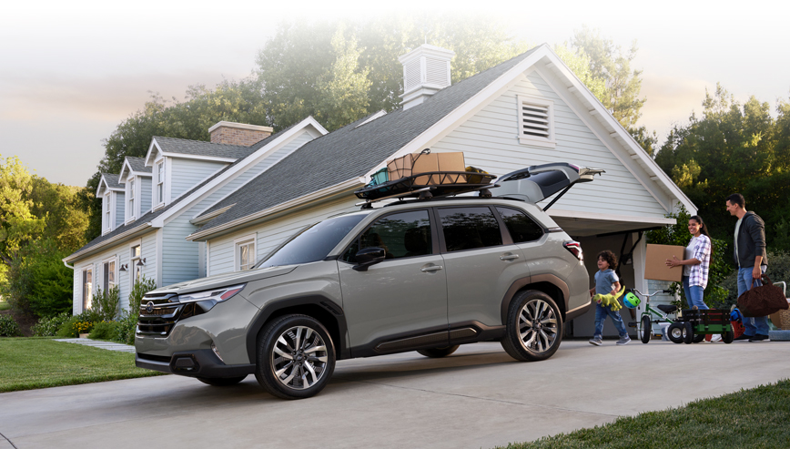 Webpage footer image of 2026 Forester Premier loading up on driveway.