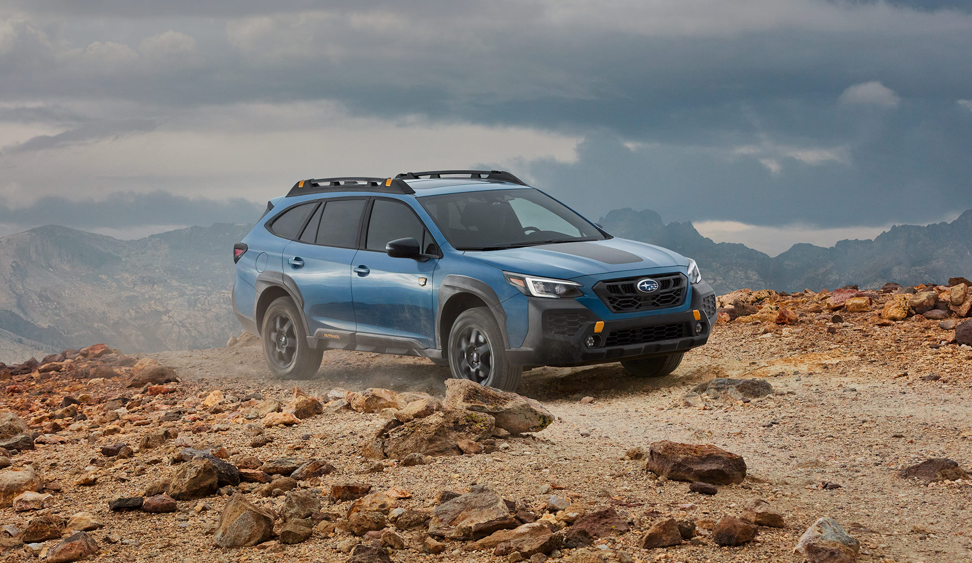 2025 Subaru Outback Wilderness 2025 Outback Wilderness driving on mountain road.